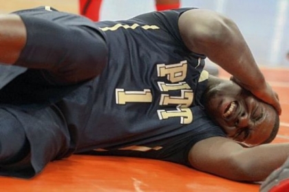 Tray Woodall grimaces after accidentally getting kicked in the head in the first half against St. John's Sunday at Madison Square Garden in New York. Woodall was the game's high scorer with 25 points in Pitt's 63-47 victory.