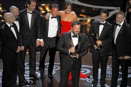 "Argo" director Ben Affleck, center, accepts the Oscar for best picture at the 85th Annual Academy Awards held Sunday night at the Dolby Theater.