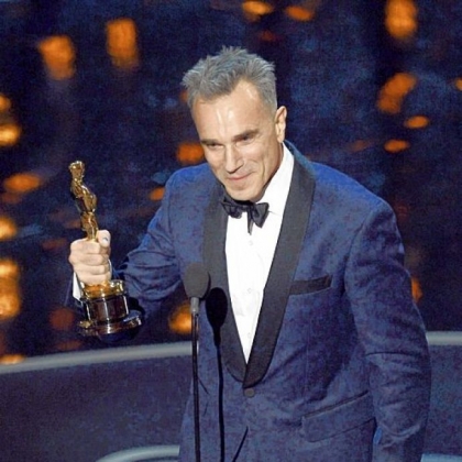 Daniel Day-Lewis accepts the best actor Oscar -- his third -- for the title role of "Lincoln."