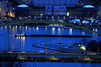 A towboat and its barges make their way to the Allegheny River between the Point and Heinz Field.