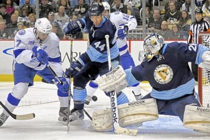 Marc-Andre Fleury stops a shot by Tampa Bay's Alexander Killorn as Brooks Orpik defends in the second period Sunday at Consol Energy Center.
