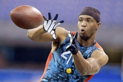 WVU receiver Tavon Austin makes a catch as he runs a drill at the NFL scouting combine in Indianapolis.