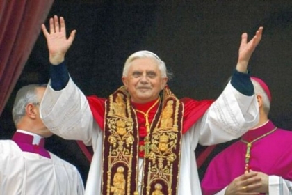 Pope Benedict XVI greets the crowd from the central balcony of St. Peter''s Basilica moments after being elected in 2005.