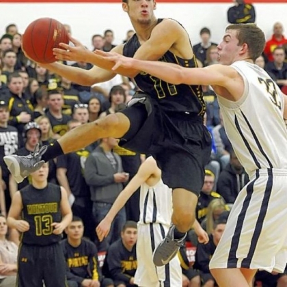 Montour's Devin Wilson, left, looks to slide a pass around Mars' Josh Goetz in a Class AAA semifinal Tuesday at Moon.