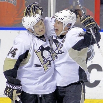 When Chris Kunitz, left, scored on a power play in the final minute of the second period to tie the score, 4-4, momentum seemed to be on the side of the Penguins. But it would be their final goal of the game. He celebrates with Sidney Crosby.