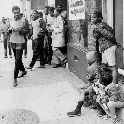 In this April 10, 1968, photo, Homewood-Brushton activists sent teams of young men wearing red vests into the Pittsburgh neighborhood to urge calm following violence in the wake of Martin Luther King Jr.'s assassination.