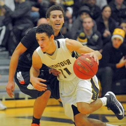 Senior guard Devin Wilson, driving around Beaver Falls' Elijah Cottrill during a game earlier this season, has led Montour by example this season.