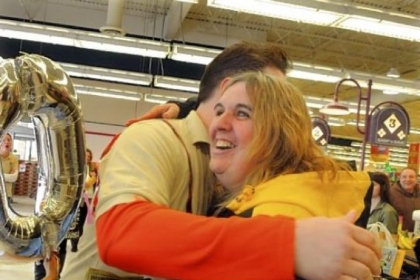 Scott Baker, of 5 Generation Bakers, embraces a smiling Ada Fiscus of McKees Rocks.