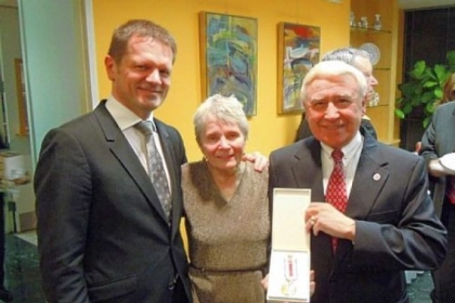 Joseph T. Senko, right, was awarded the Medal of the President of the Slovak Republic. He and his wife, Albina, center, traveled to Washington, D.C., Feb. 1 to receive the medal and met with Slovak ambassador Peter Kmec, left.