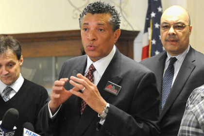 A coalition of community groups headed by Tim Stevens, center, of the Black Political Empowerment Project and Vic Walczak, left, of the American Civil Liberties Union holds a news conference Wednesday. At right is city Councilman Ricky Burgess.