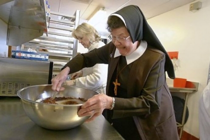 Sister Rose Marie Tumicki mixes a batch of Ruby Jubilee Brownies at Our Lady of the Sacred Heart High School in Moon.