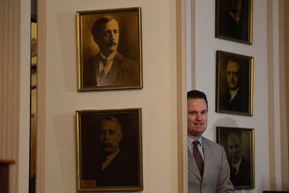 Mayor Luke Ravenstahl enters the press conference where he announced he would not run for re-election.