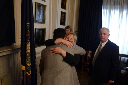 Pittsburgh Mayor Luke Ravenstahl gets a hug from his mother, Cindy, as his father, Judge Robert Ravenstahl looks on.