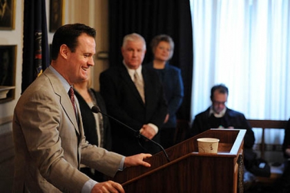 Mayor Luke Ravenstahl smiles during the press conference announcing he will not run for re-election. His parents, Cindy and Judge Robert Ravenstahl, look on.