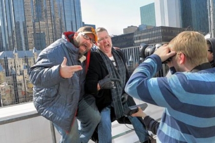 Filming takes place on deck overlooking Market Square for one of the intro videos for the Addy awards. Performing are Matt Hildebrand, left, and James Nesbitt. Behind the camera is Matt Fridg and working the sound playback is Erica Sperber.
