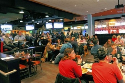 Patrons can eat and watch the Penguins game on big screens at the Sports Theater on the first floor.