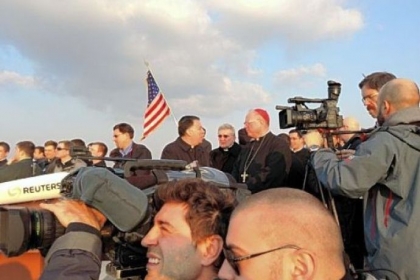 Bishop David Zubik of Pittsburgh, background with sunglasses, was among a crowd of Catholic clergy and news media that stood on the roof of the North American College to watch Pope Benedict XVI's helicopter depart the Vatican.