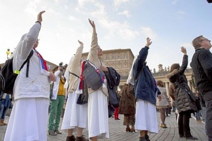 Nuns wave as the helicopter carrying Pope Benedict XVI passes by St Peter's Square on Thursday in Vatican City. Pope Benedict XVI has been the leader of the Catholic Church for eight years and is the first pope to retire since 1415.