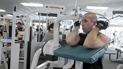 Mark Bennardo of Ross uses the weight machines during a workout at Club Julian, Ross.