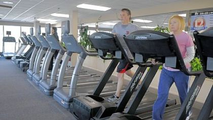 Members of Club Julian work out on the treadmills.