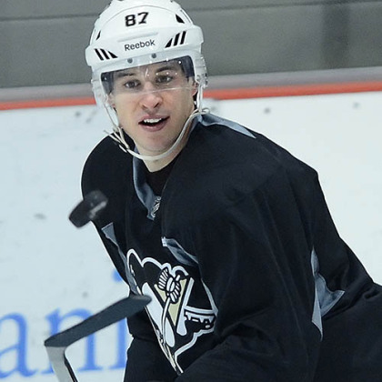 Pittsburgh Penguins' captain Sidney Crosby eyes up the puck during workouts today at the team's practice facility in Southpointe.
