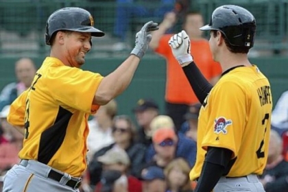 Gaby Sanchez is greeted by Brad Hawpe Friday after hitting his second home run against the Orioles in Sarasota, Fla.