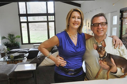 Helene and Regis McQuaide with their dog Stella in their new kitchen.
