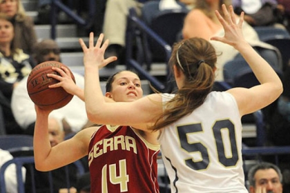 Serra Catholic's Jessica Manfredi looks to pass around Vincentian's Brenna Wise.
