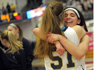 Vincentian teammates celebrate after beating Serra Catholic for the Class A girls title.