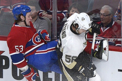 Montreal's Ryan White collides with the Penguins' Kris Letang in the second period of the Penguins' 7-6 win.