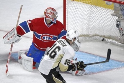 Montreal goaltender Carey Price is scored on by the Penguins' Brandon Sutter in an overtime.