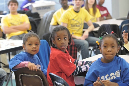 Damiyah Watson, 5, Kamili Wiley, 7, and Aniya Avery, 6, listen at a press conference where WQED Multimedia and The Heinz Endowments representatives announce that they want to collect hundreds of video vignettes showing how black men and boys are making a difference in their communities.