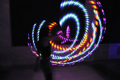 Mallory Sarver of Moon Township makes art using a lighted hula hoop, taken with a long camera exposure.