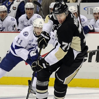 The Penguins' Evgeni Malkin works the puck around the Lightning's Tom Pyatt in the first period Monday night at Consol Energy Center.