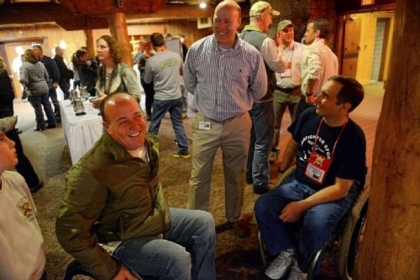 Charles Mays, left, of Meansville, Ga., a former Army National Guard member who served in Iraq in 2005, speaks with John Hess, center, director of sales at Seven Springs, and Erik Burmeister, a former Army National Guard member from Williamsport, during a Wounded Warriors retreat at Seven Springs on Tuesday.
