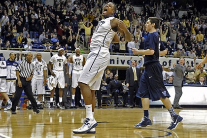 Pitt's Dante Taylor celebrates after dunking in the final seconds against Villanova in overtime Sunday at the Petersen Events Center.