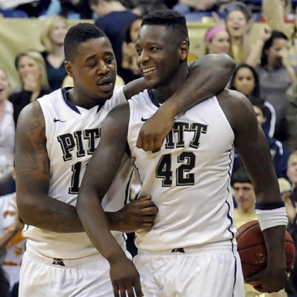 Pitt's Dante Taylor and Talib Zanna celebrate near the end of overtime against Villanova Sunday at the Petersen Events Center.