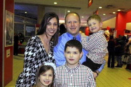 Stephanie and Tim Palochak, holding Carter,3, with in front, Ella, 6, and Blake, 8