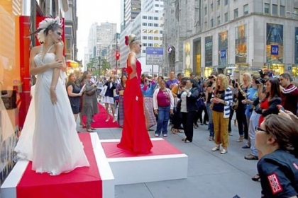 Models pose outside the Elizabeth Arden store on Fifth Avenue during Fashion's Night Out in New York in 2011. The annual shopping event, a  part of New York Fashion Week since 2009, has been discontinued.