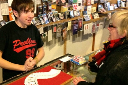 Vince Smith, 18, demonstrates illusions using a deck of cards at the Cuckoo's Nest on the South Side.