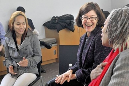 Mary Beth Maxwell, center, acting head of the Wage and Hour Division for the U.S. Department of Labor, talks with Sandra Burden, right, during a session Monday at the Hill District branch of the Carnegie Library of Pittsburgh. At left is Nikki Edmonds, who makes minimum wage at Party City.