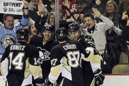Chris Kunitz, Simon Despres and Sidney Crosby congratulate Evgeni Malkin after his third-period goal.