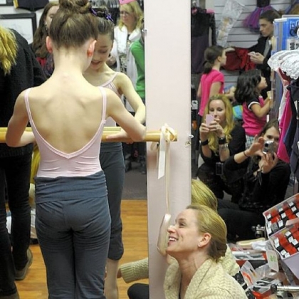 Pittsburgh Ballet School principal Anastasia Wovchko helps fit one of her students, Gianna Christensen, 10, of Pine with her first pointe shoes at The Dancer's Pointe in the Strip District.