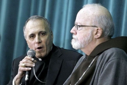 Cardinal Daniel Nicholas DiNardo, archbishop of Galveston-Houston, left, and Cardinal Sean Patrick O'Malley, archbishop of Boston, attend a news conference Tuesday at the Pontifical North American College in Rome.