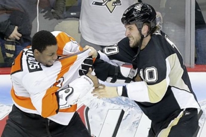Tanner Glass fights with Philadelphia Flyers right wing Wayne Simmonds during a Feb. 20 game. The two teams meet again tonight in Philadelphia.