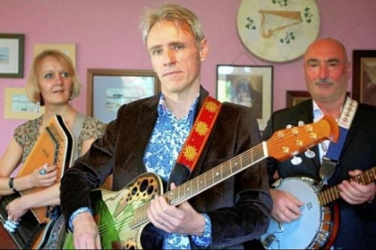 Peter, center, one of the subjects of "56 Up," in his band The Good Intentions with fellow members Gabi, his wife, left, and Francesco in "56 Up."