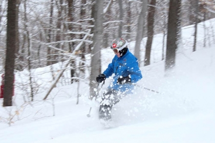 Skier John Denard enjoys a fresh powder run on Hidden Valley Resort's Cobra Glades Wednesday morning.
