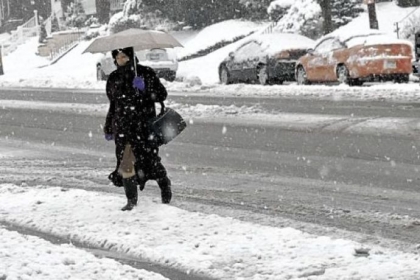 Jean Herskowitz dashes across Beacon Street in Squirrel Hill just in time to catch the bus heading toward Downtown at 8 a.m. Wednesday.