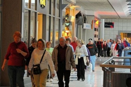 People walk the upper-level of the Westmoreland Mall  To walk the upper and lower levels equal one mile.