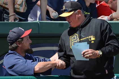 Clint Hurdle says hello to Joel Hanrahan before the Pirates-Red Sox game Wednesday in Fort Myers, Fla.